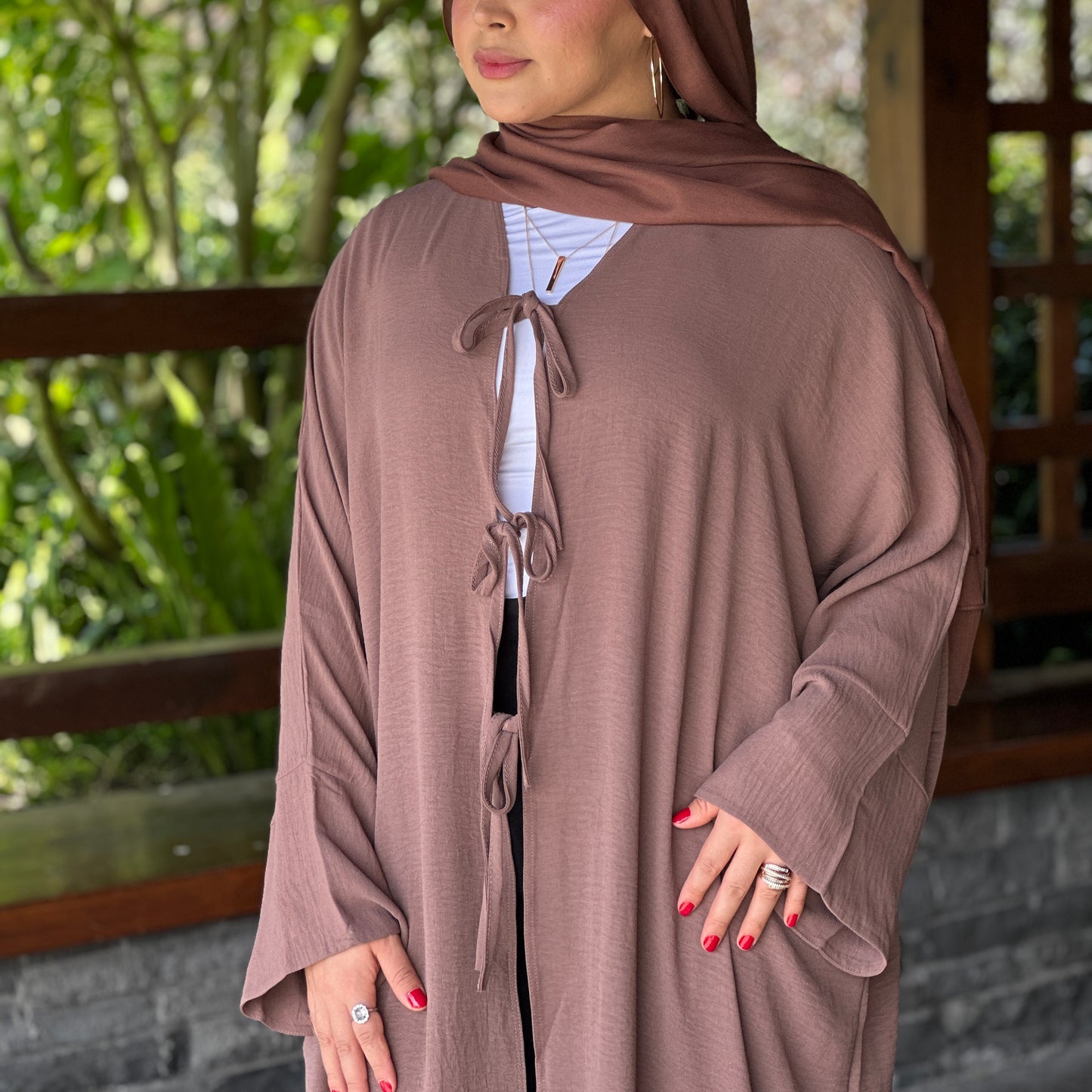 Front view of Althena Abaya showing elegant bow-tie design – Hijabaan NZ