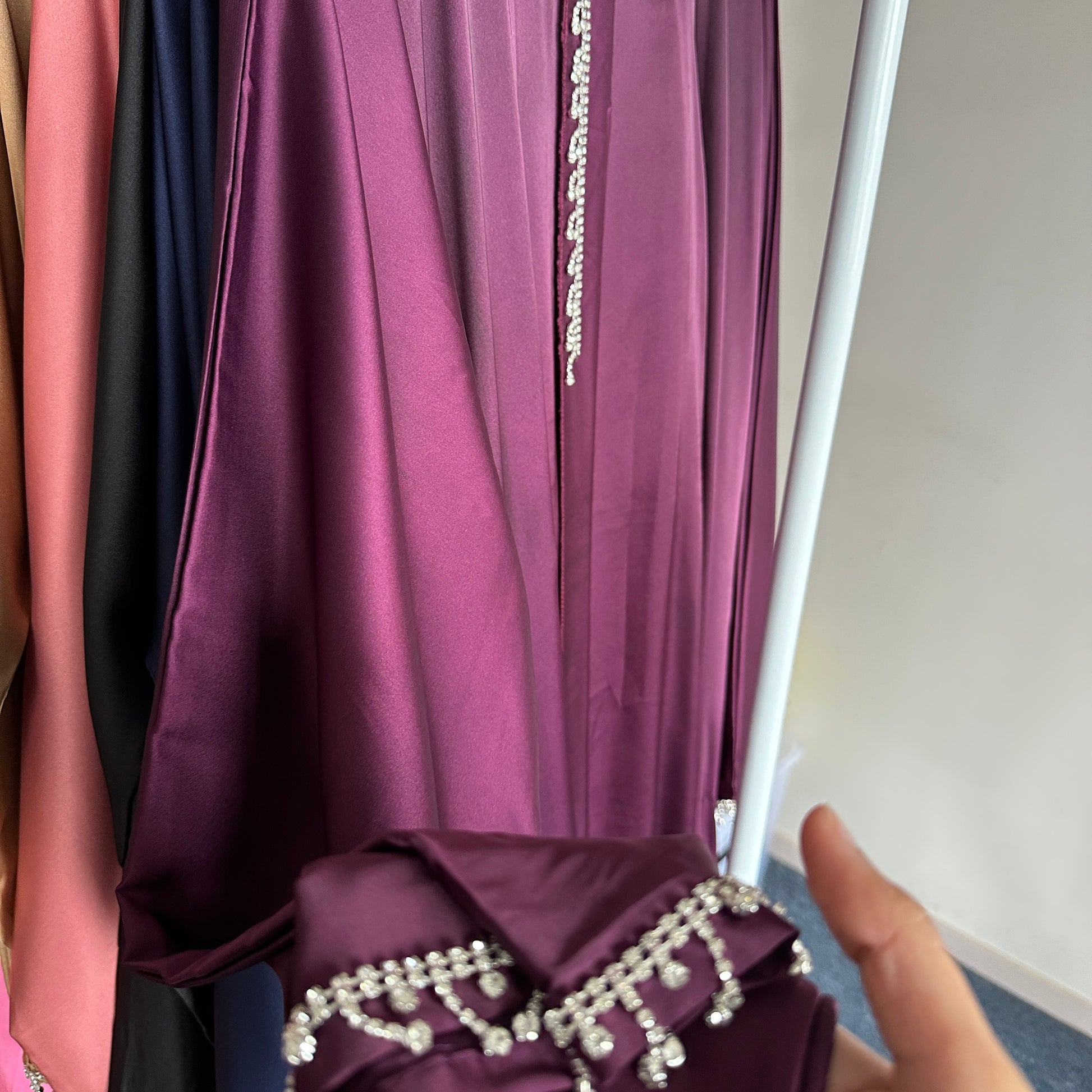 Zoomed-in shot of the Armani silk fabric texture with subtle shine