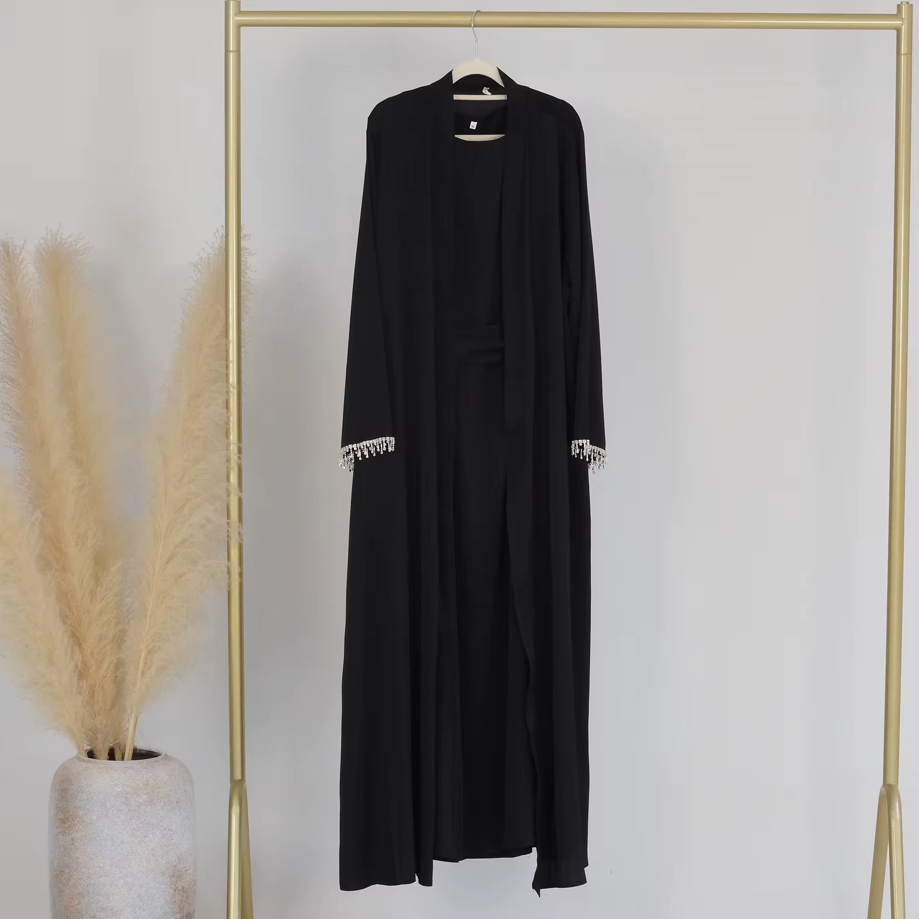 Full-length view of the black Armani silk abaya – elegant and flowy modest dress