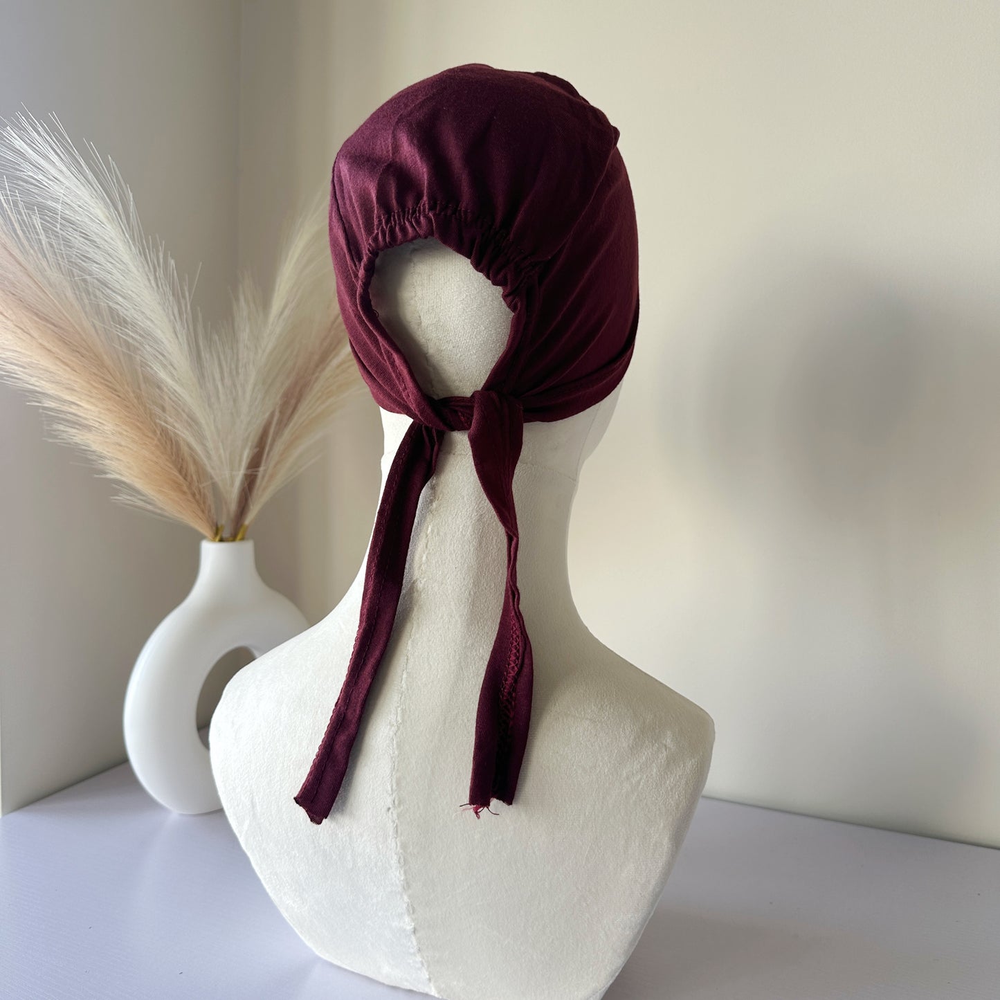 Rear view showing the adjustable tie of the hijab cap