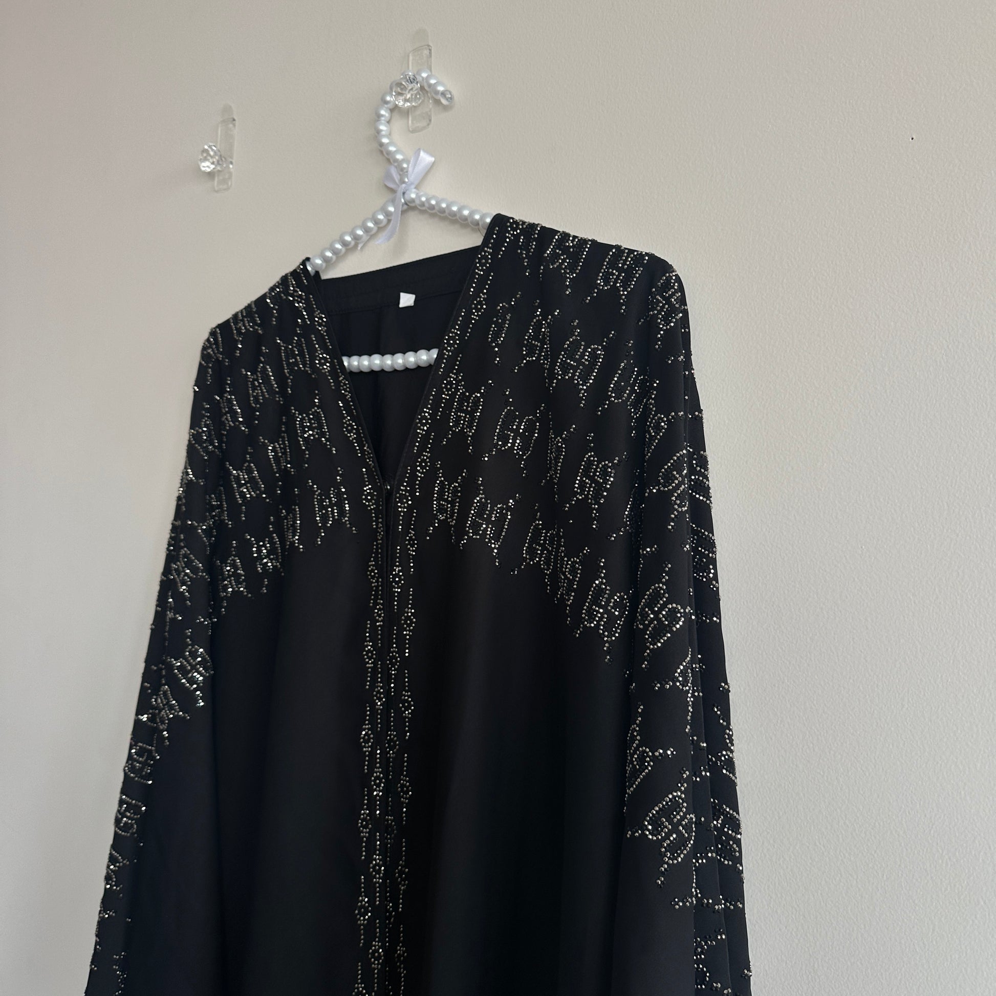 Front view of Noir Abaya showing diamond embellishment – Hijabaan NZ
