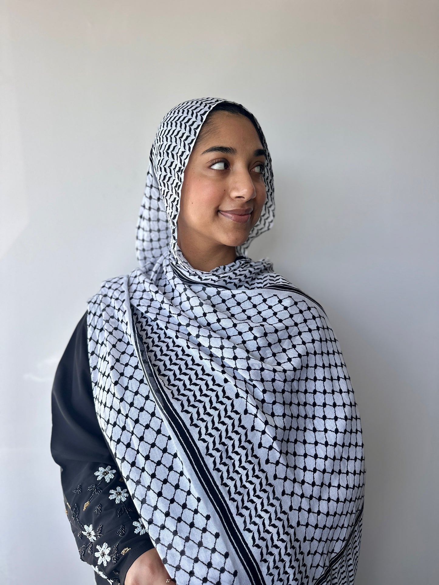 White Keffiyeh printed modal hijab – styling view showing elegant drape, Hijabaan Auckland